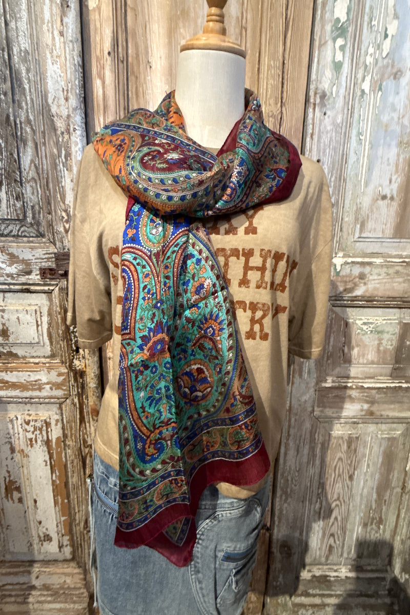 Trestles Clothing Company silk boho scarf featuring a vibrant multi-colored paisley print on a mannequin